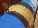 Pipe joint protected with Denso Tape and black PVC outerwrap